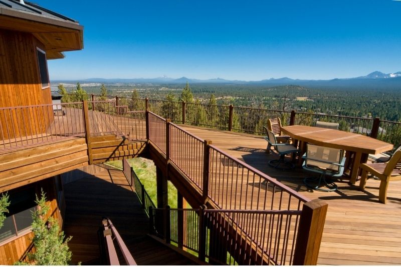 spacious top deck with a stairs with a beatiful mountain view