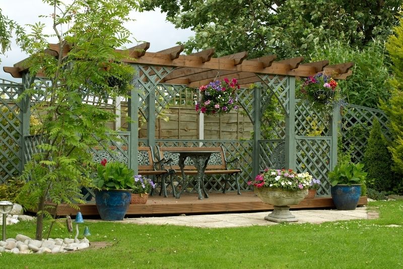 stunning decking pergola area with flowers